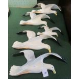 Two Beswick seagulls, together with three other Beswick-style seagulls.