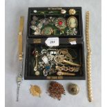 A quantity of costume jewellery contained in a leather jewellery box.