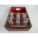 A 19th century mahogany and brass bound campaign six bottle decanter box, complete with six bottles.