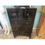 A contemporary black painted chest of six small drawers over one long drawer on square supports.