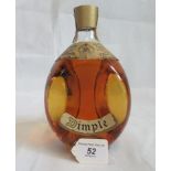 A bottle of Old Blended Dimple Scotch Whisky.