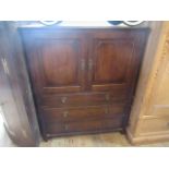 An early 20th century walnut cabinet, having two doors above three long drawers.