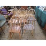 A set of eight near matching mid-20th century dining chairs.