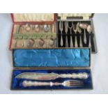 A cased set of silver plated spoons and sugar tongs,