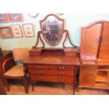 An Edwardian mahogany dressing table, with two door super structure,