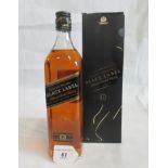 A bottle of Johnny Walker 12 Year Old Black Label Scotch Whisky.