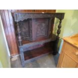 A 19th century and later profusely carved oak court cupboard.