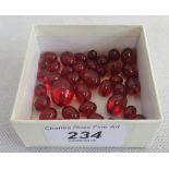 A quantity of cherry coloured beads.