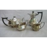 A four piece silver tea set, comprising: coffee pot, tea pot, twin handled sugar bowl and cream jug,