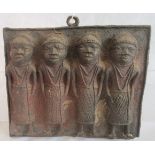 A 20th century Nigerian Benin bronze plaque, depicting four figures.
