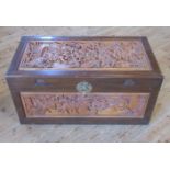 An early 20th century profusely carved camphor wood chest.