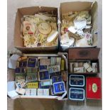 Three boxes of various cigarette and tea cards.