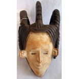 A 20th century Agbogho Mmuo mask of the Igbo people of Nigeria.