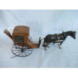 A scratch built Hansom carriage and horse.