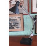 A 20th century black and chrome angle poise lamp.
