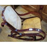 A contemporary bentwood and caned child's rocking chair.