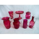 Seven pieces of cranberry glass, to include: tazza with Greek Key decoration, crackleware jug,