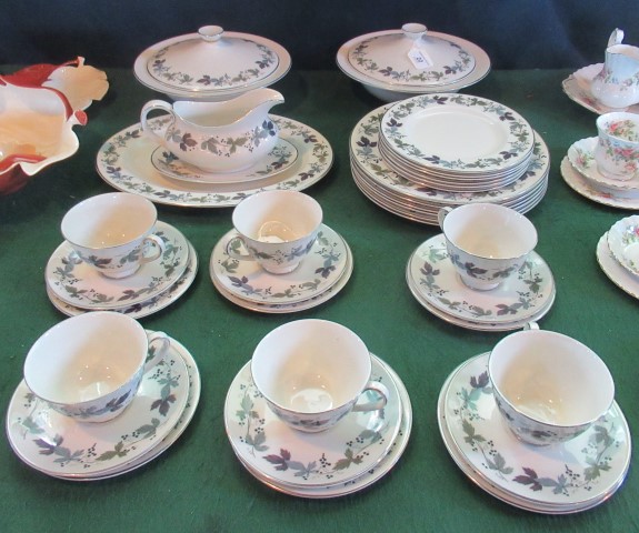 A Royal Doulton part-dinner service decorated in the Burgundy pattern, comprising: lidded tureens,