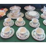 A Royal Doulton part-dinner service decorated in the Burgundy pattern, comprising: lidded tureens,