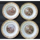 A set of four 19th century Prattware side plates, each depicting a rural scene upon a cream ground,