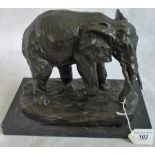 A 20th century bronze of an elephant on marble plinth.