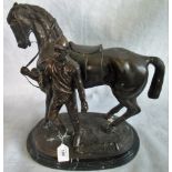 A 20th century bronze group, horse and rider on marble plinth.