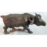 A 20th century carved figure of a water buffalo.