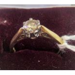 A single stone diamond ring, the brilliant cut diamond in raised claw mount,