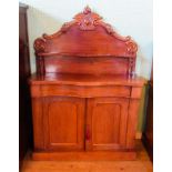A 19th century mahogany chiffonier with shaped and carved upper section,