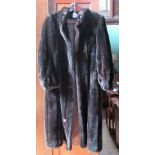 A lady's full length fur coat.