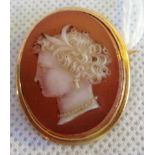 A Victorian carved agate cameo, the oval bust portrait of a lady in simple gold mount.