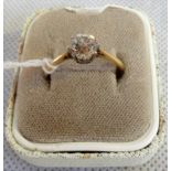 A single stone diamond ring, the old brilliant cut diamond in simple claw mount,