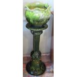 A Majolica-style jardiniere on stand.