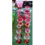 A collection of cranberry glass, to include: oil lamp, ice bucket, salts,