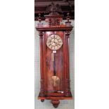 A 19th century mahogany Vienna wall clock, with eagle surmount and Roman numerals on a painted dial.