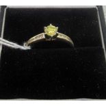 A single stone yellow diamond ring,