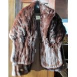 A lady's natural ranch mink jacket, together with a matching stole, with original receipt.