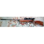 A .22 air rifle complete with sights. Condition Report: Scope - Webley.