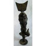 A 20th century bronze figure of an African chief.