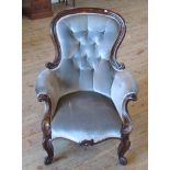 A Victorian mahogany framed fireside chair,