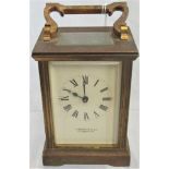 A brass carriage clock by Garrard & Company.