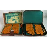 Two cased Mahjong sets.
