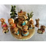 A collection of ten Pendelfin rabbits in the form of musicians, together with stand and piano,