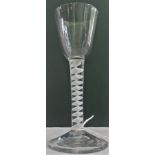 A 19th century opaque wine glass with lattice work stem on stepped conical foot, 14cm tall.