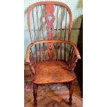 A 19th century oak and elm hooped back Windsor armchair.