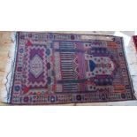 A small patterned Belouch rug, 132 x 78cm.