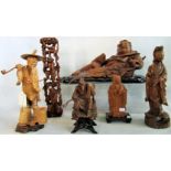 A quantity of mid-20th century Oriental wooden carvings.