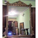 A large 19th century gilt framed over mantle mirror, with swag and leaf decoration.