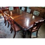 A large Edwardian oak drawer leaf table,