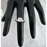 A single stone two carat diamond ring, the brilliant cut diamond in simple four claw mount,